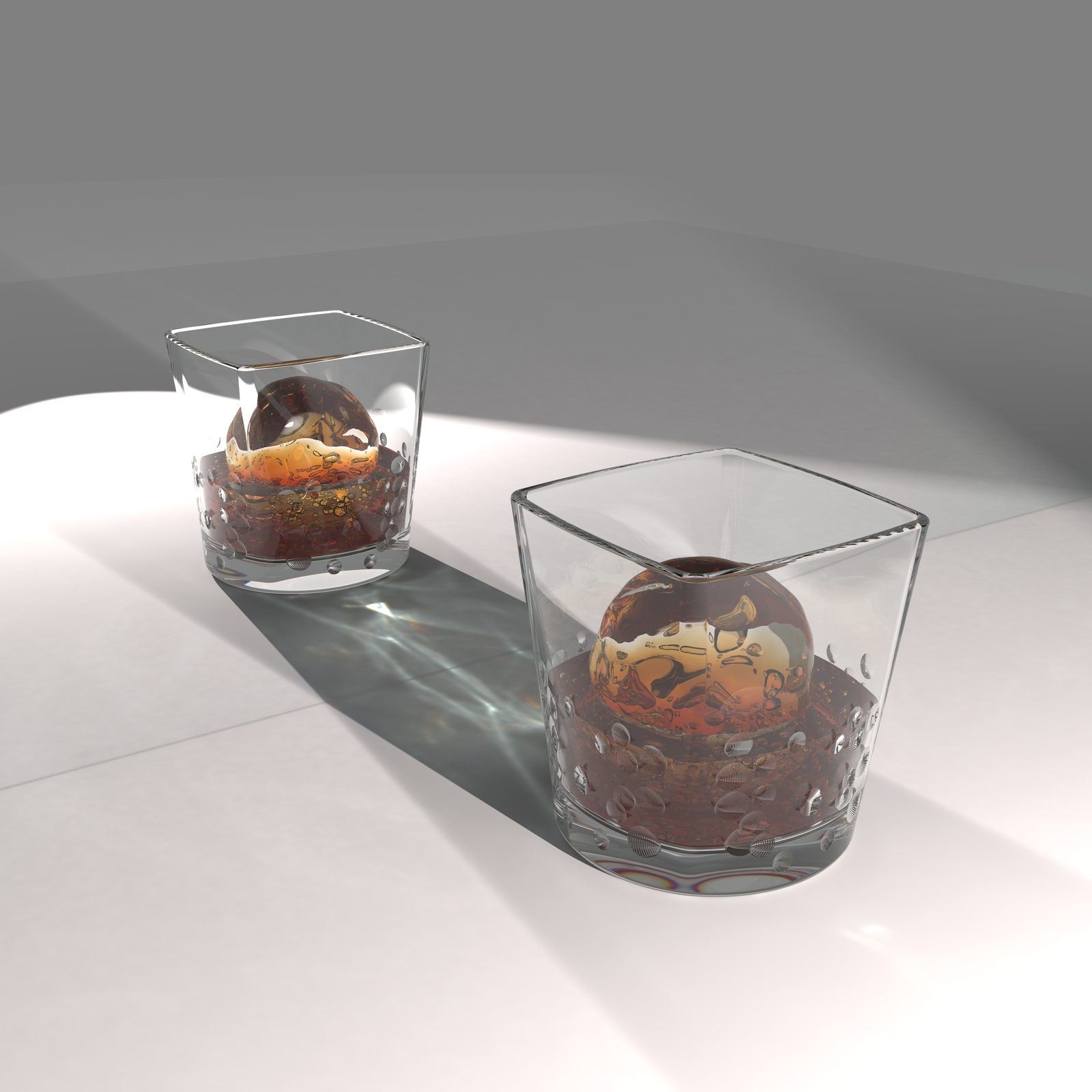Whisky tumblers with spherical ice — a glass and light study